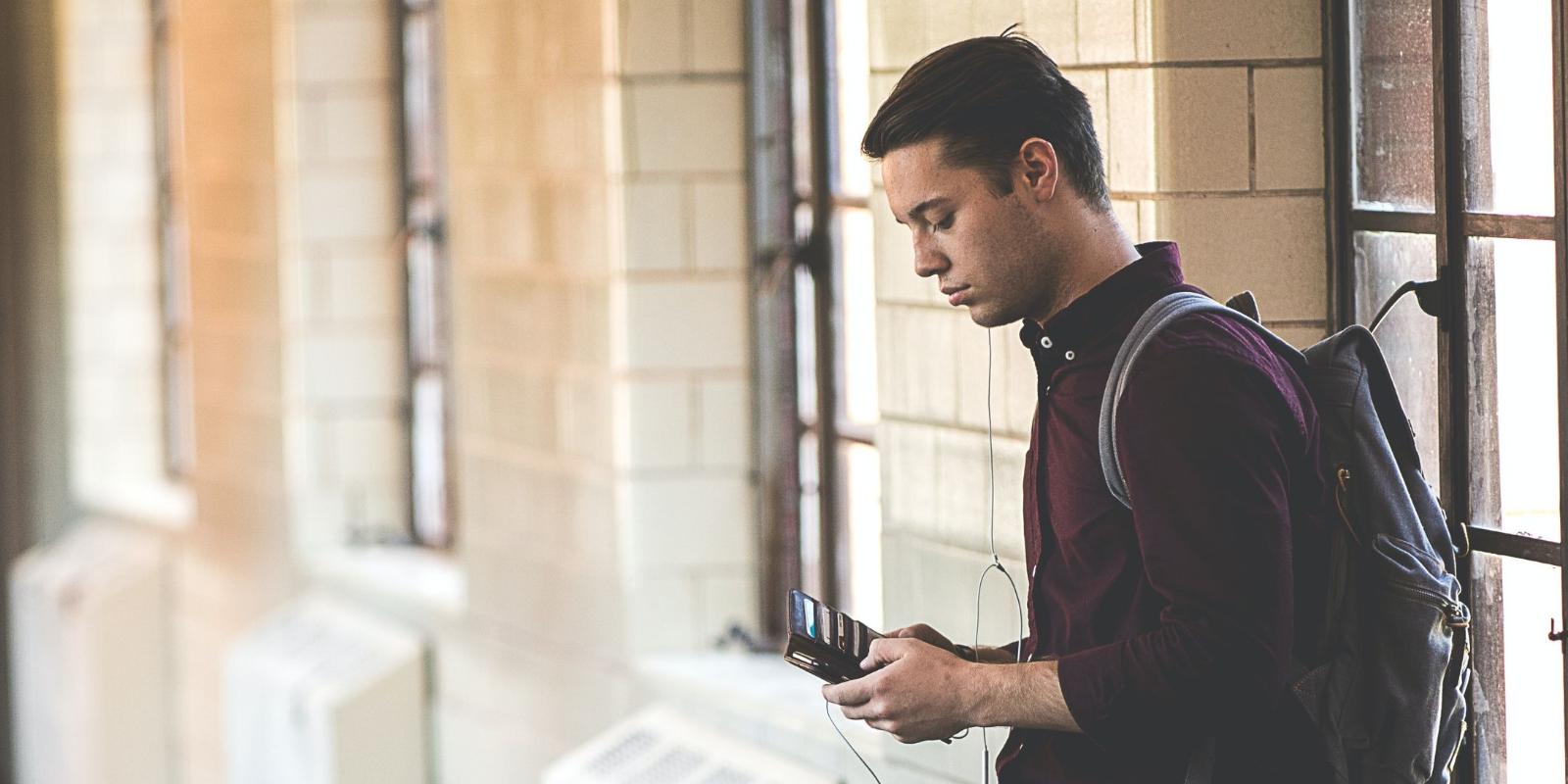 student looking at cell phone